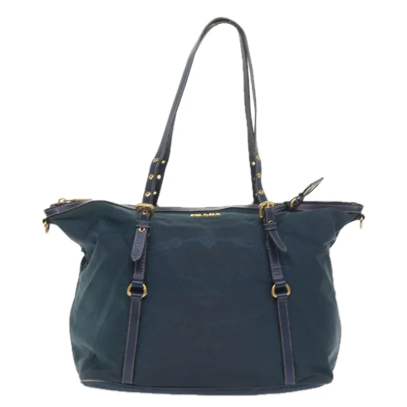 Prada bags with a snap - button closure and a decorative charm for a fashionable lookPRADA Tessuto Shoulder Bag