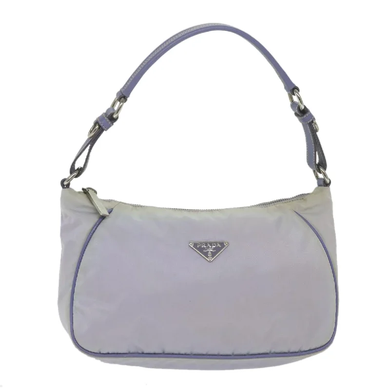 Prada Cleo bags with a contrast - colored interior for visual interestPRADA Tessuto Handbag