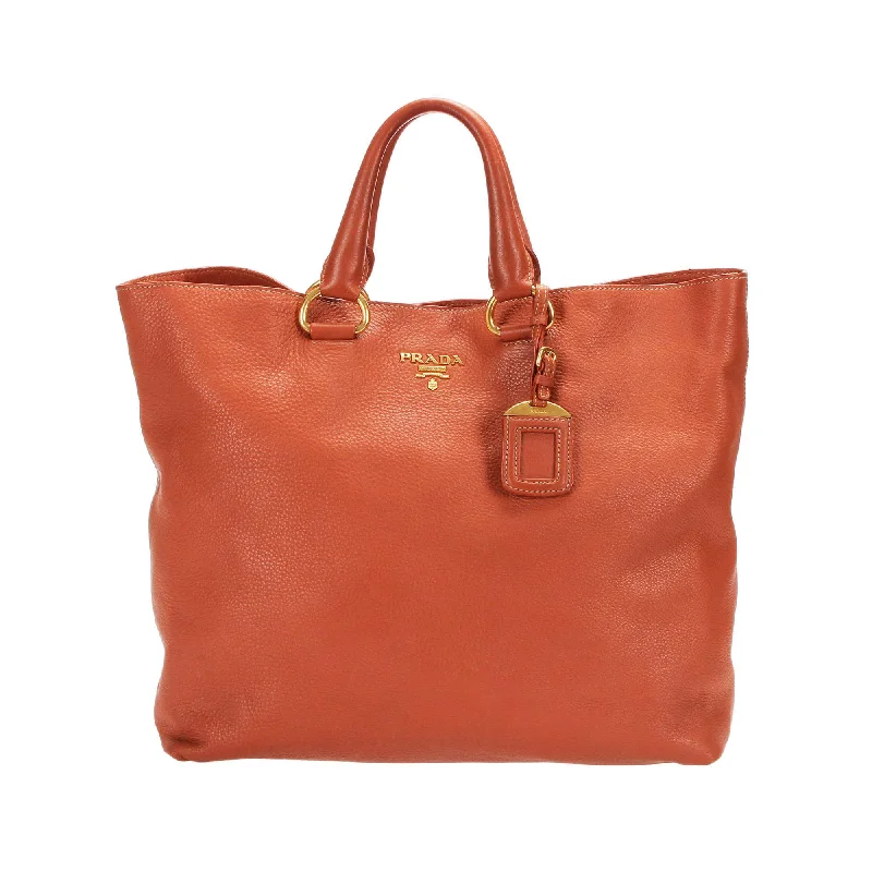 Prada bags with a snap - button closure and a decorative charm for a fashionable lookPrada Vitello Daino Tote  (SHG-13172)