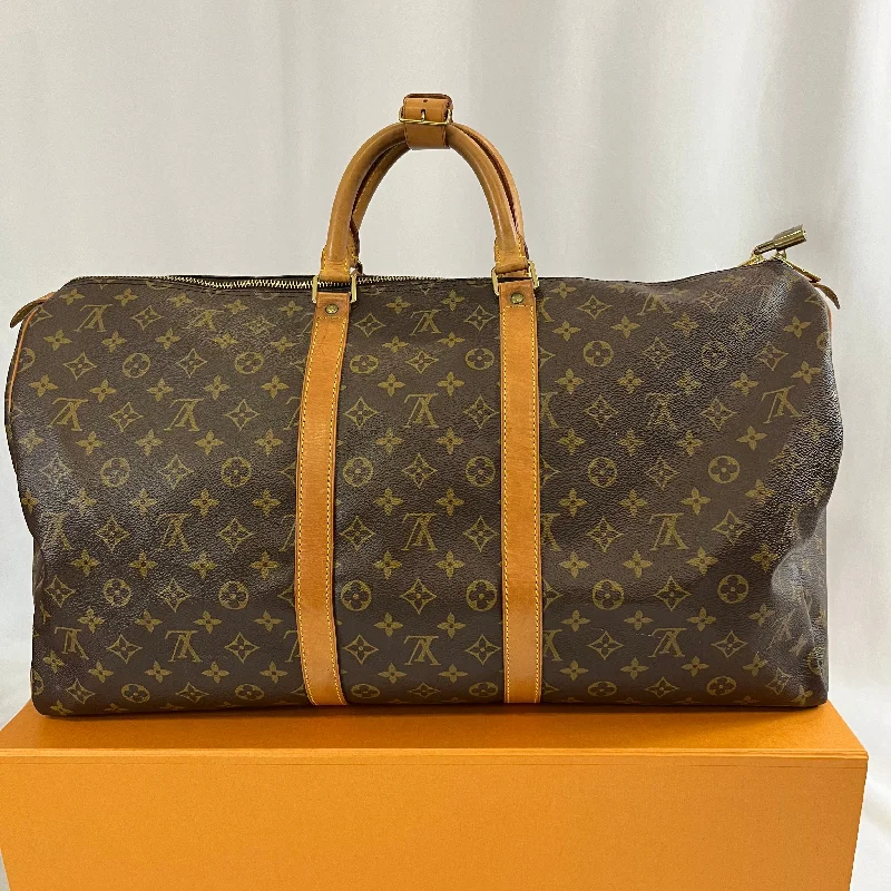 Louis Vuitton bags with a snap - button closure and a decorative charm for styleLouis Vuitton - sac Keepall 60