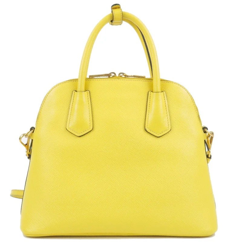 Prada Cleo bags with a contrast - colored interior for visual interestPRADA Leather 2Way Hand Bag Shoulder Bag Yellow BL0907