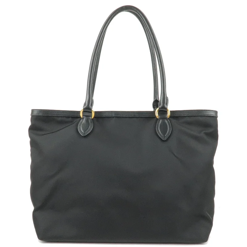 Prada Cleo bags with a contrast - colored interior for visual interestPRADA Logo Nylon Leather Tote Bag Shoulder Bag Black 1BG159