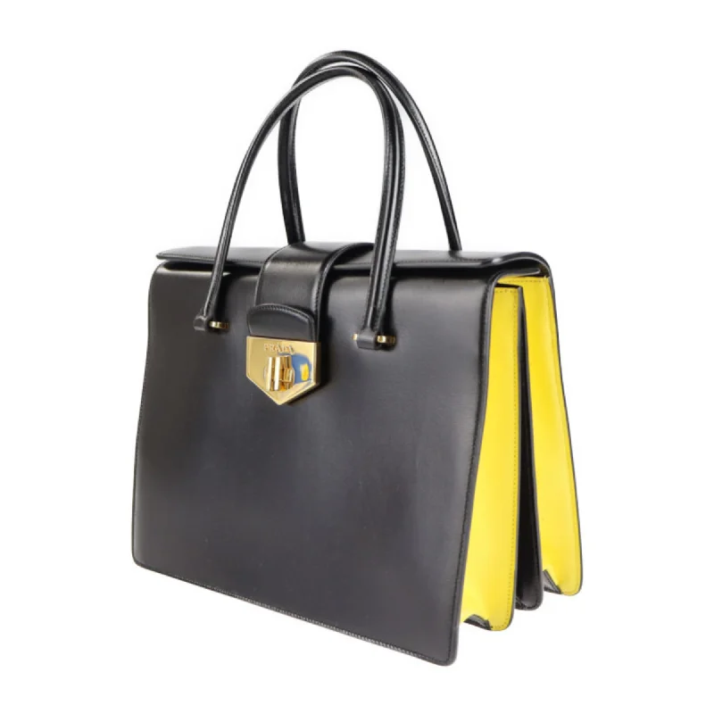 Prada tote bags with a spacious interior and a magnetic - snap closurePrada turn lock handBag B2725C box calf black yellow