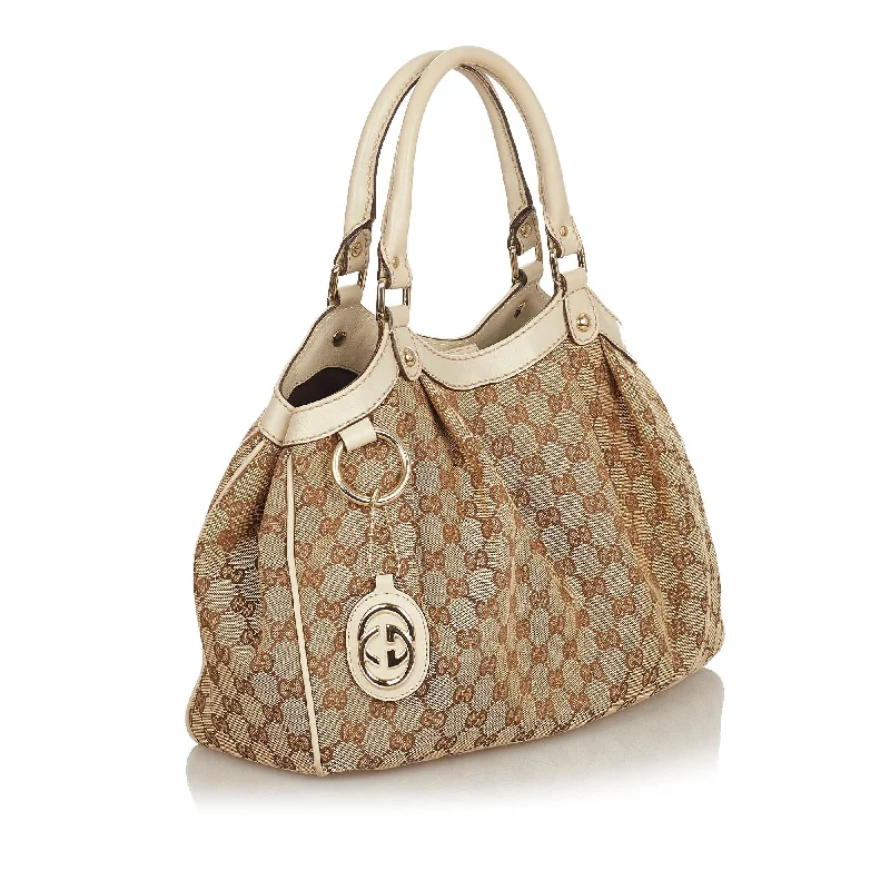 Gucci Marmont bags for women with quilted leather exteriorsGucci GG Canvas Sukey Tote Bag (25496)