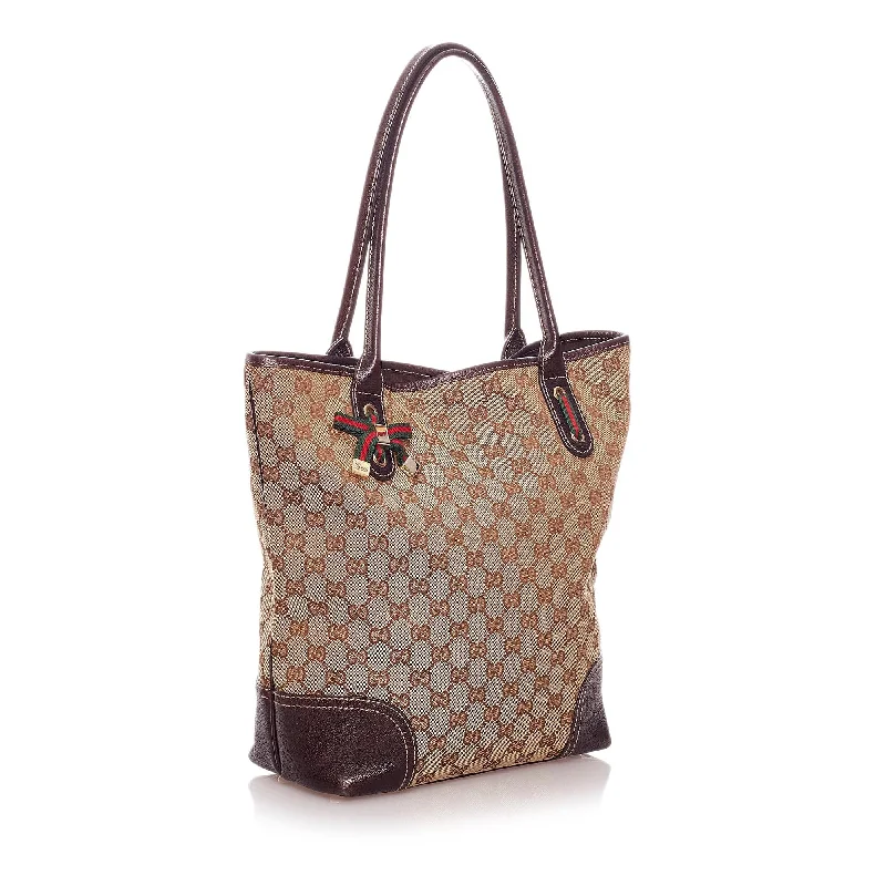 Women Gucci bags with a snap - button closure and a decorative charmGucci GG Canvas Princy Tote Bag (29182)