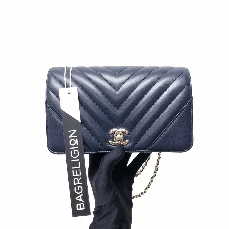 Chanel bags with the perfect balance of luxury and functionalityCalfskin Chevron Quilted Mini Statement Flap Navy Blue