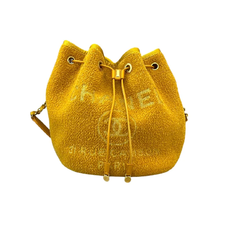 Chanel bags with iconic stitching detailsDeauville Drawstring Bucket Striped Canvas Yellow GHW